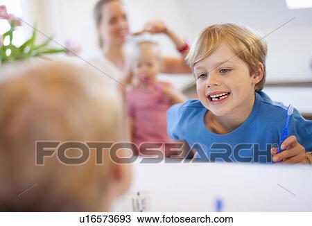 Stock Image - Boy brushing his teeth. Fotosearch
