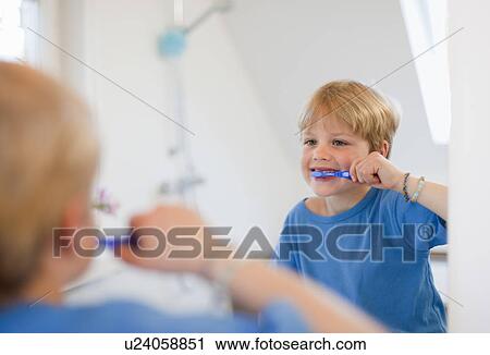 Stock Image - Boy brushing his teeth. Fotosearch