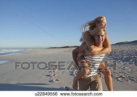 Stock Photograph - Boy carrying Girl. Fotosearch