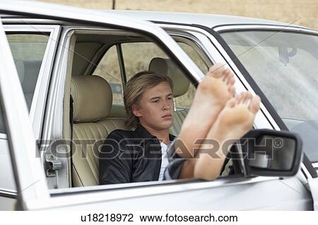 Boy chilling in the car View Large Photo Image Stock Image - Boy chilling in the car. Fotosearch
