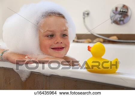 Boy covered in bubbles in bathtub View Large Photo Image Picture - Boy covered in bubbles in bathtub. Fotosearch