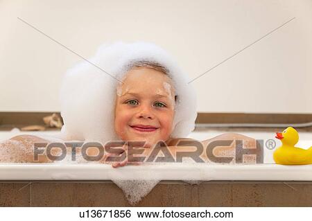 Boy covered in bubbles in bathtub View Large Photo Image Stock Photograph - Boy covered in bubbles in bathtub. Fotosearch