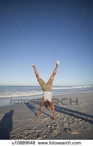 Boy doing handstand View Large Photo Image Stock Photo - Boy doing handstand. Fotosearch