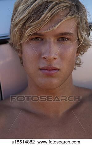 Stock Image - Boy looking in camera. Fotosearch