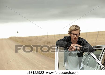 Boy looking on watch View Large Photo Image Stock Image - Boy looking on watch. Fotosearch