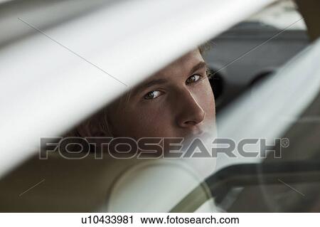 Boy looking through window View Large Photo Image Stock Image - Boy looking through window. Fotosearch