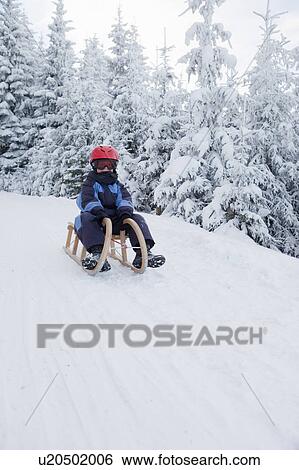 Boy on wooden sled View Large Photo Image Stock Photograph - Boy on wooden sled. Fotosearch