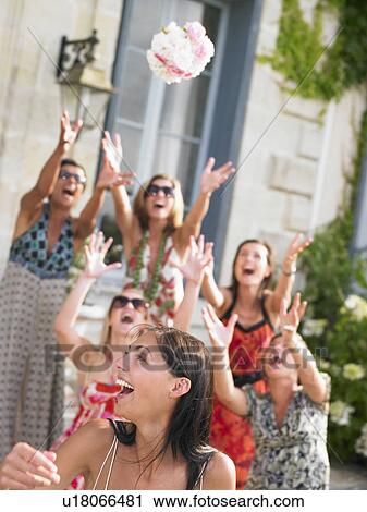 Bride throwing her bouquet View Large Photo Image Stock Image - Bride throwing her bouquet. Fotosearch