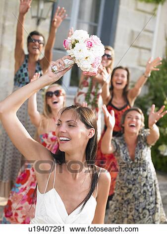 Bride throwing her bouquet View Large Photo Image Stock Image - Bride throwing her bouquet. Fotosearch