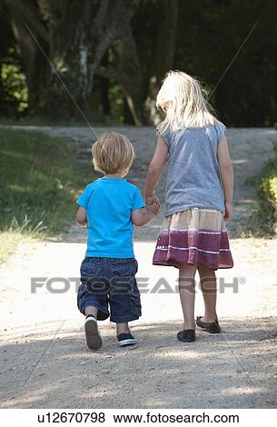 Stock Photo - Brother and sister holding hands. Fotosearch