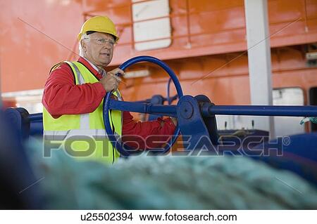Builder doing maintenance works View Large Photo Image Picture - Builder doing maintenance works. Fotosearch