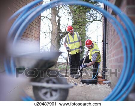 Builders installing water pipes View Large Photo Image Stock Image - Builders installing water pipes. Fotosearch