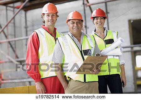 Building workers and architect View Large Photo Image Picture - Building workers and architect. Fotosearch