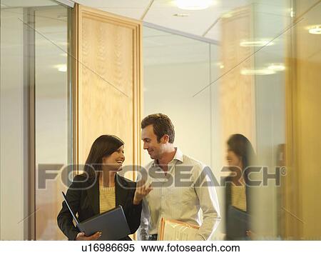 Business couple chatting View Large Photo Image Stock Photography - Business couple chatting. Fotosearch