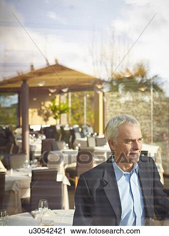 Business man in Restaurant View Large Photo Image Stock Image - Business man in Restaurant. Fotosearch