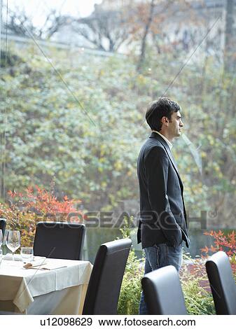 Stock Photo - Business man in Restaurant. Fotosearch