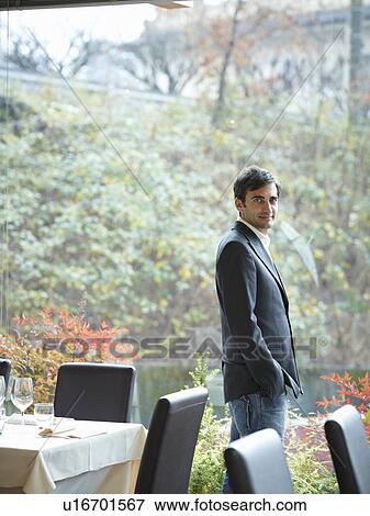 Business man in Restaurant View Large Photo Image Stock Photo - Business man in Restaurant. Fotosearch