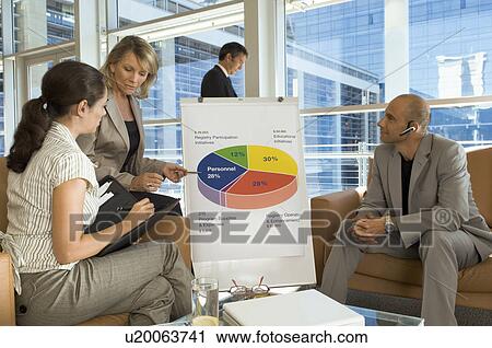Business people in a meeting View Large Photo Image Stock Image - Business people in a meeting. Fotosearch