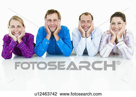 Business team laying on floor View Large Photo Image Stock Image - Business team laying on floor. Fotosearch