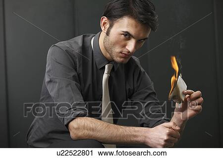 Businessman burning paper View Large Photo Image Stock Image - Businessman burning paper. Fotosearch