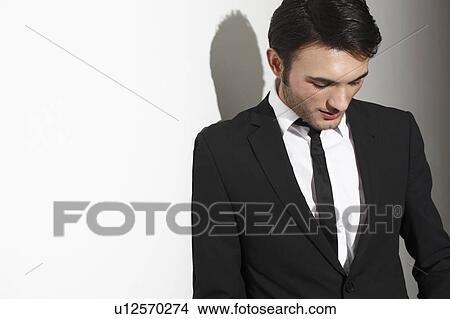 Businessman looking down View Large Photo Image Picture - Businessman looking down. Fotosearch