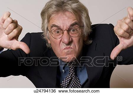 Businessman making thumbs down gesture View Large Photo Image Stock Photograph - Businessman making thumbs down gesture. Fotosearch