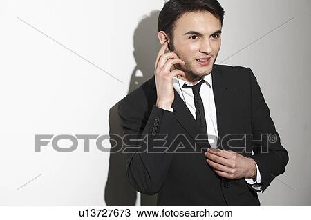 Businessman talking on headset View Large Photo Image Stock Image - Businessman talking on headset. Fotosearch