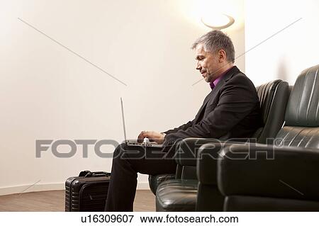Stock Photo - Businessman using Laptop. Fotosearch