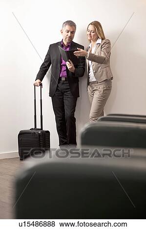 Stock Photo - Businesspoeple discussing documents. Fotosearch