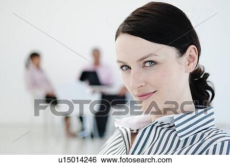 Businesswoman and colleagues View Large Photo Image Stock Photograph - Businesswoman and colleagues. Fotosearch