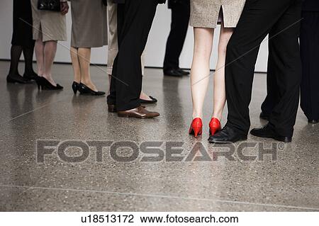 Stock Image - Businesswoman wearing red shoes. Fotosearch