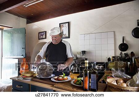 Chef cooking in kitchen View Large Photo Image Stock Image - Chef cooking in kitchen. Fotosearch