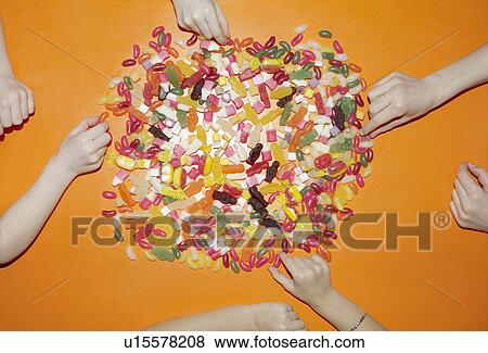 children's hands choosing sweets View Large Photo Image Stock Photo - children's hands choosing sweets. Fotosearch