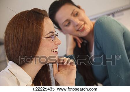Close up of 2 women smiling looking off View Large Photo Image Stock Photography - Close up of 2 women smiling looking off. Fotosearch
