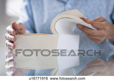 Stock Photograph - close up of a book being opened. Fotosearch