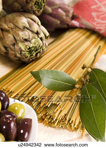 Close up of artichokes, pasta and olives View Large Photo Image Stock Image - Close up of artichokes, pasta and olives. Fotosearch