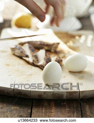 Close up of eggs on cutting board View Large Photo Image Stock Image - Close up of eggs on cutting board. Fotosearch