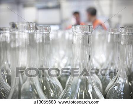 Close up of empty bottles in plant View Large Photo Image Stock Image - Close up of empty bottles in plant. Fotosearch