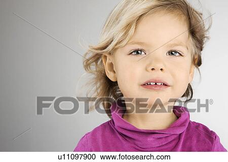 Stock Image - Close up of girl smiling. Fotosearch