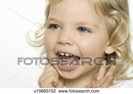 Stock Image - Close up of girl smiling. Fotosearch