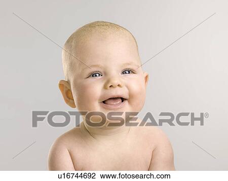 Stock Image - Close up of laughing baby. Fotosearch