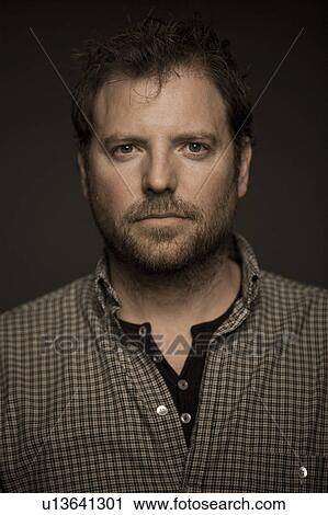 Close up of serious man View Large Photo Image Stock Image - Close up of serious man. Fotosearch