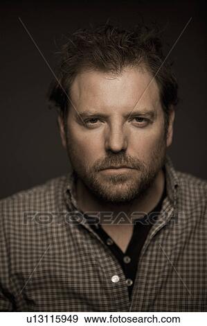 Stock Photo - Close up of serious man. Fotosearch