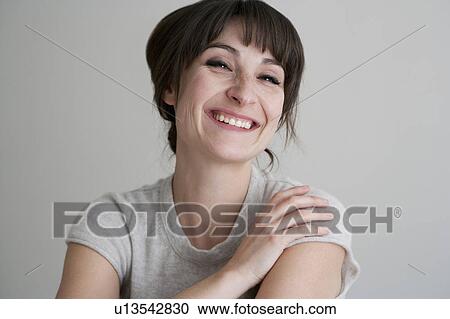 Stock Image - Close up of smiling woman. Fotosearch