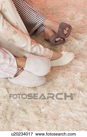 Close-up of three females in slippers View Large Photo Image Stock Photo - Close-up of three females in slippers. Fotosearch