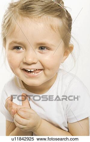 Close up of toddler girl smiling View Large Photo Image Stock Photography - Close up of toddler girl smiling. Fotosearch