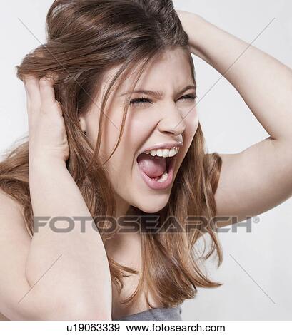 Close up of woman screaming View Large Photo Image Stock Photo - Close up of woman screaming. Fotosearch
