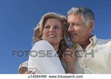 Closeup of mature couple embracing View Large Photo Image Stock Photo - Closeup of mature couple embracing. Fotosearch