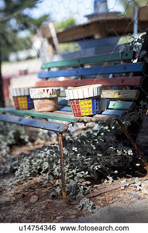 Stock Photograph - Coloured bank with coloured jars. Fotosearch