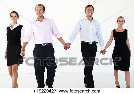 Confident walking business team View Large Photo Image Stock Photo - Confident walking business team. Fotosearch
